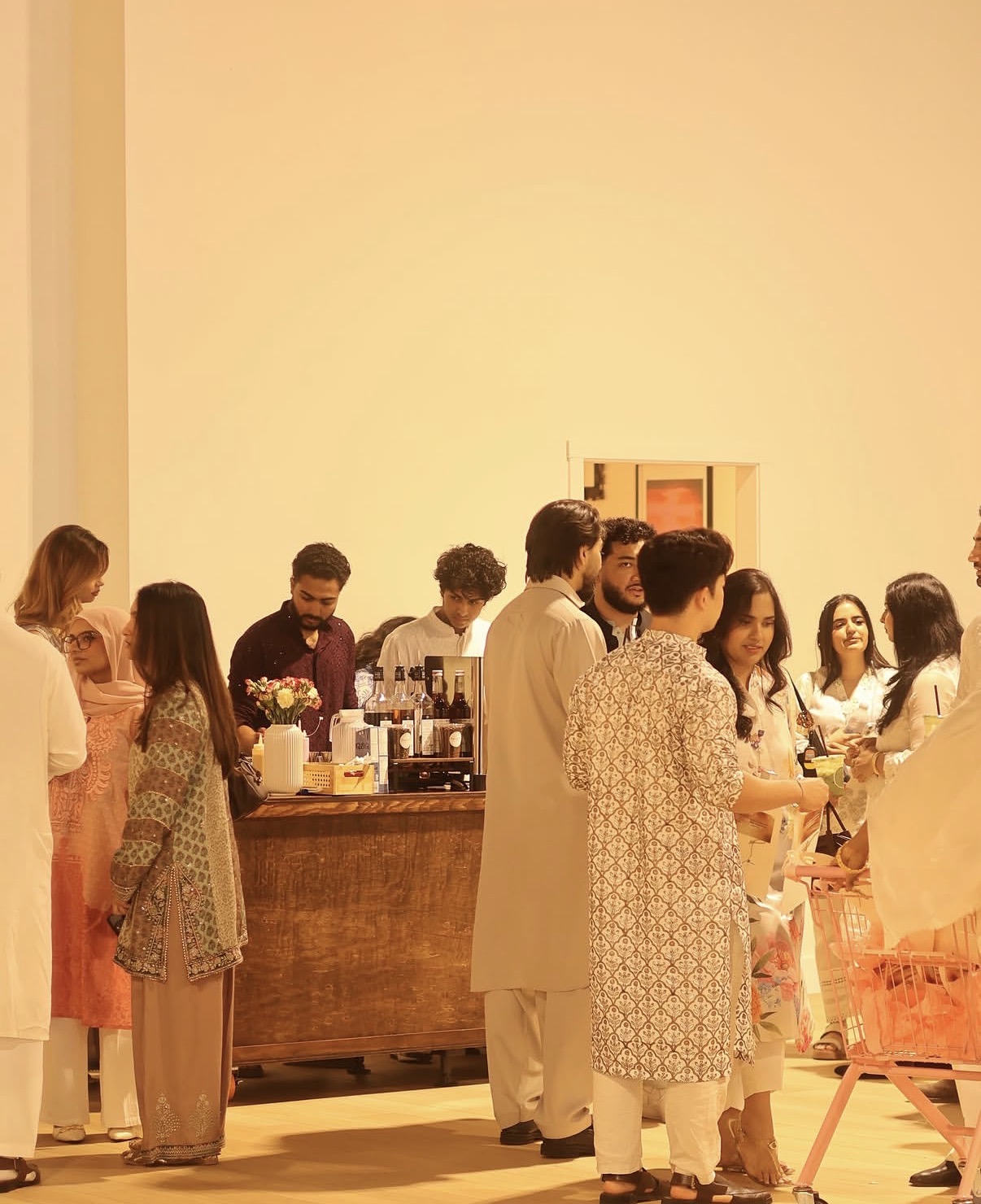 A crowd gathered at the Pour & Co cart during a private event